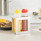 Restaurantware Squeeze Bottle Holder Pack of 1 Stainless Steel 2 Hole Bottle Holder, 2.5" Diameter Fits 1/9 Size Opening, Dishwasher Friendly Integrated Lip Design Holder for Condiment Bottles